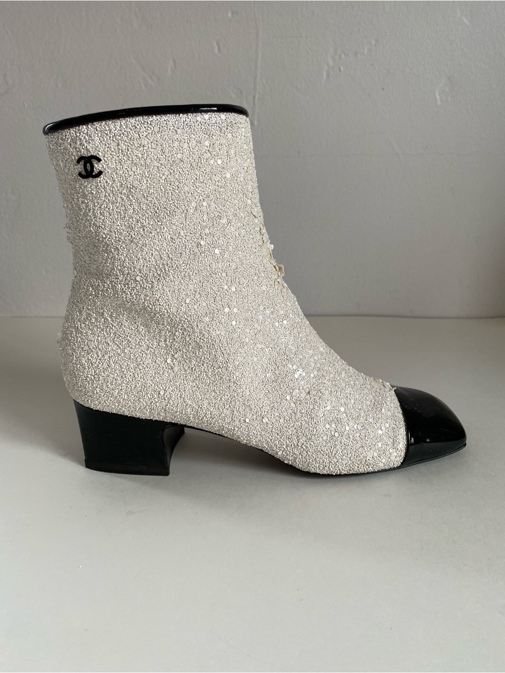 CHANEL White Sequin Ankle Boots with Black Cap Toe. Runway astronaut collection.